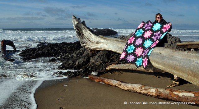 Me holding the quilt in the wind!