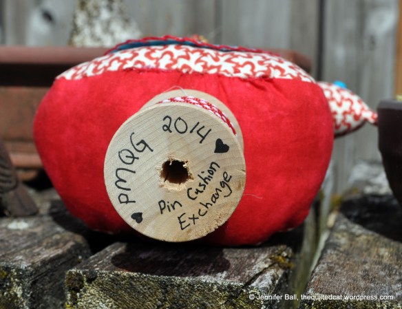 Bottom of Wooden Spool on Bird Pin Cushion